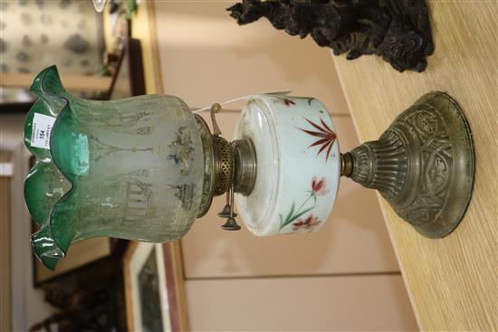 Two Victorian oil lamps and a centrepiece